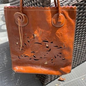 Cut Out Tooling Collection Floral Tote. 100% Full grain leather.